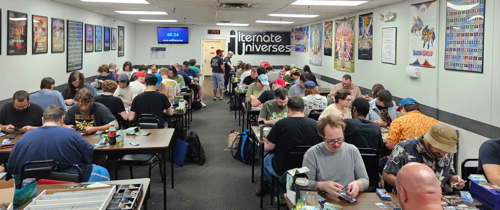 Alternate Universes Holmes Community A room full of people enjoying a tournament at Alternate Universes Holmes.